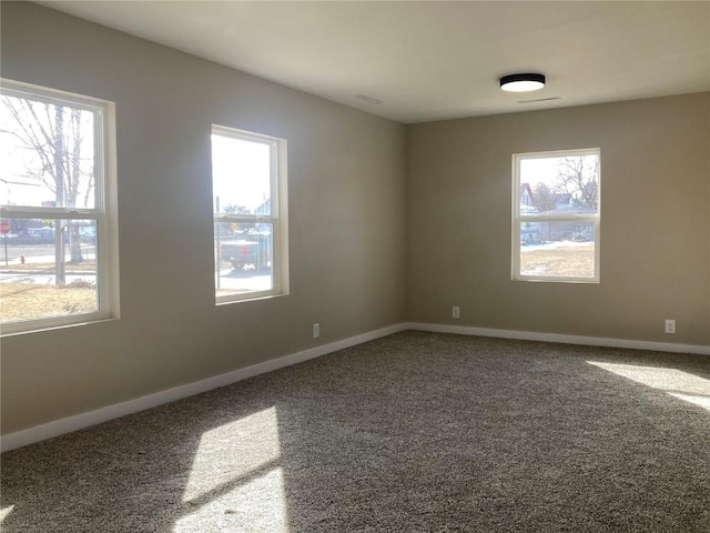 208 G Ave, Vinton, IA 52349 - carpeted spare room featuring baseboards