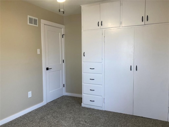 208 G Ave, Vinton, IA 52349 - unfurnished bedroom featuring carpet and baseboards