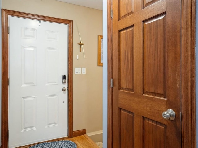 entryway featuring baseboards