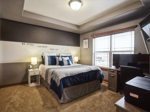 bedroom with baseboards and carpet