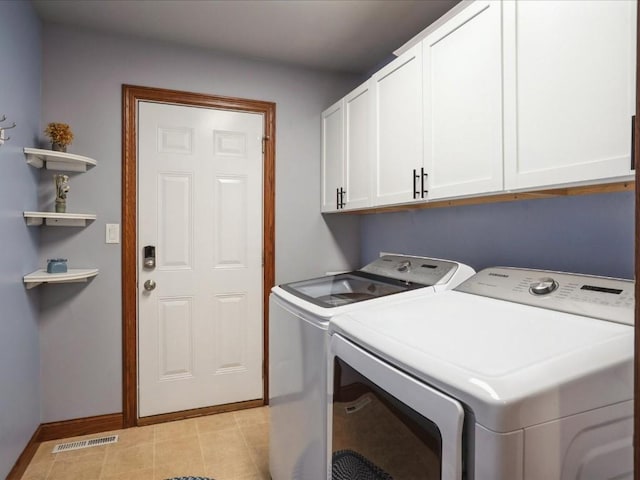 laundry area with visible vents, cabinet space, independent washer and dryer, and baseboards