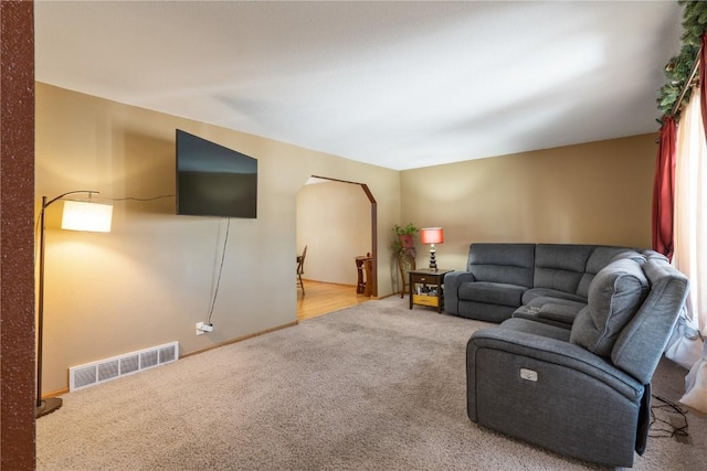 living area with carpet and visible vents