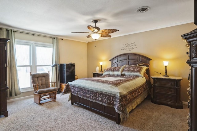 bedroom featuring ornamental molding, carpet, visible vents, and baseboards