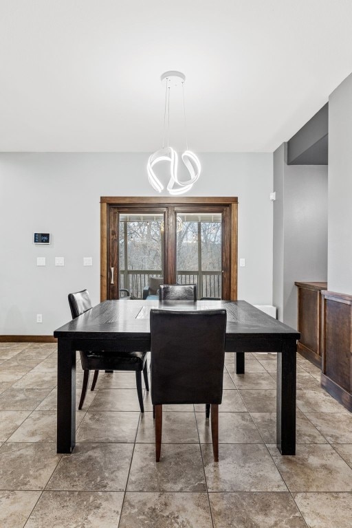 dining space with an inviting chandelier