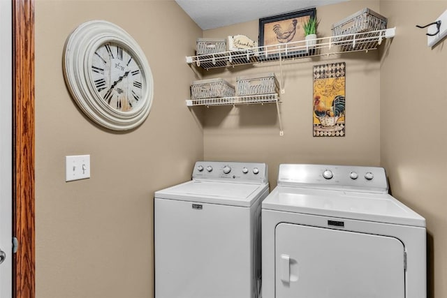 washroom featuring laundry area and independent washer and dryer