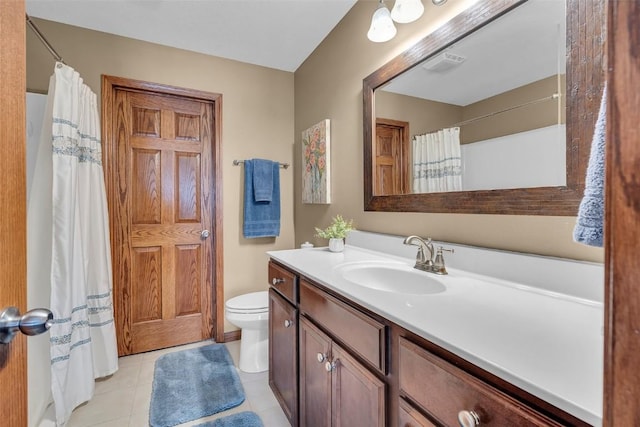 full bathroom with vanity, a shower with shower curtain, visible vents, tile patterned floors, and toilet