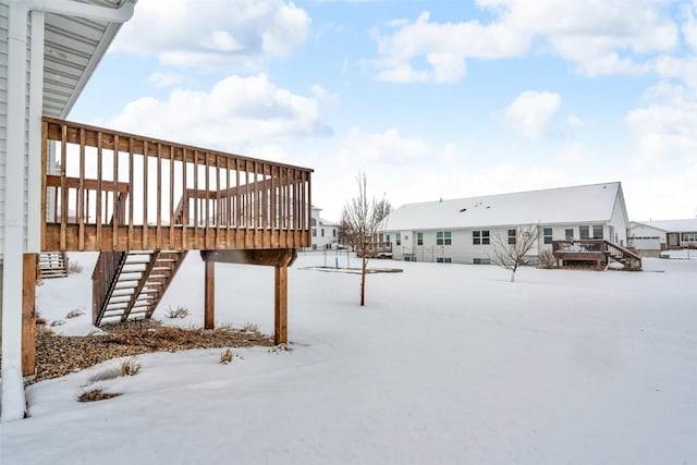 yard layered in snow with stairs