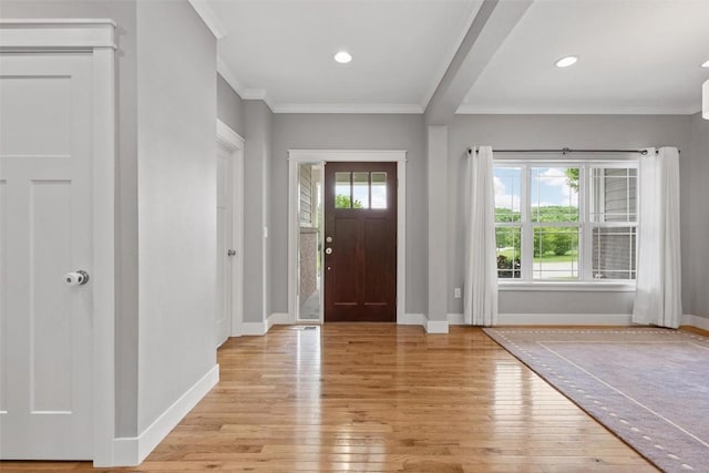 entrance foyer with light wood-style floors, baseboards, crown molding, and recessed lighting