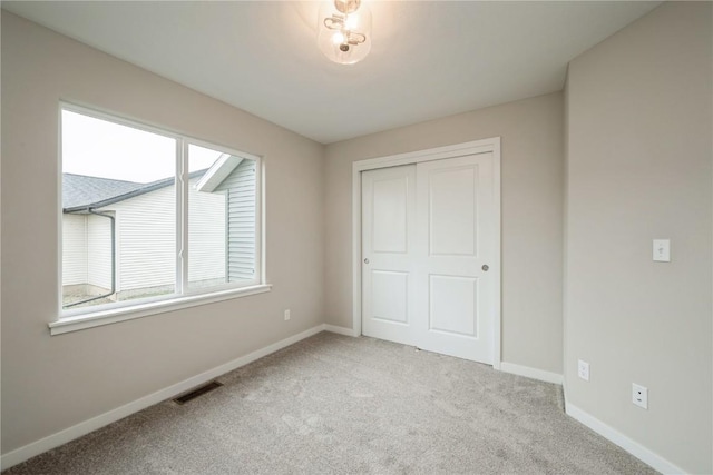 6166 Cope Dr, Marion, IA 52302 - unfurnished bedroom with carpet floors, baseboards, and a closet