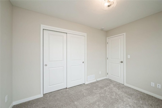 6166 Cope Dr, Marion, IA 52302 - unfurnished bedroom with carpet, baseboards, and a closet
