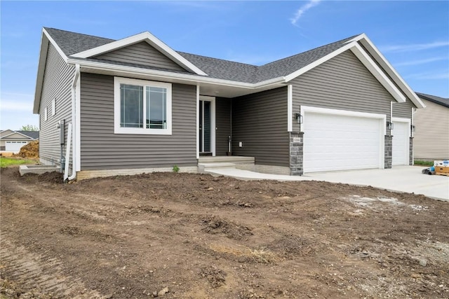 6166 Cope Dr, Marion, IA 52302 - ranch-style house featuring an attached garage, driveway, and roof with shingles