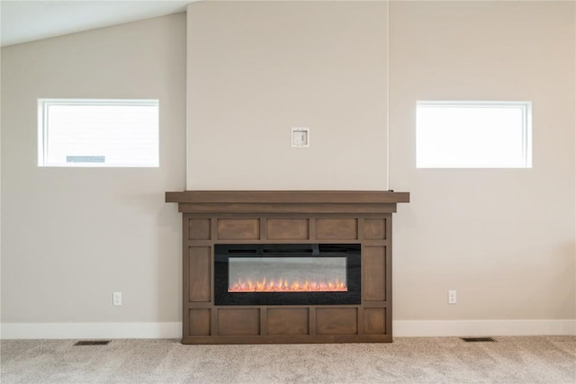 6166 Cope Dr, Marion, IA 52302 - detailed view of carpet floors, a glass covered fireplace, and baseboards
