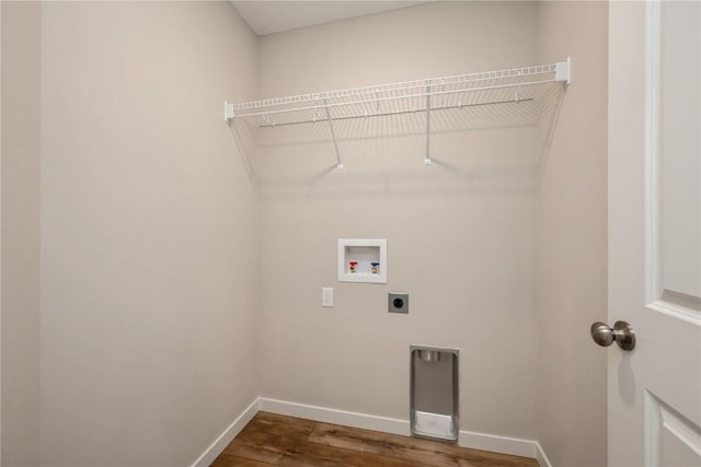 6166 Cope Dr, Marion, IA 52302 - washroom with electric dryer hookup, washer hookup, dark wood-type flooring, and baseboards
