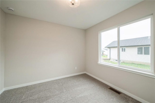 6166 Cope Dr, Marion, IA 52302 - carpeted spare room with baseboards and a smoke detector