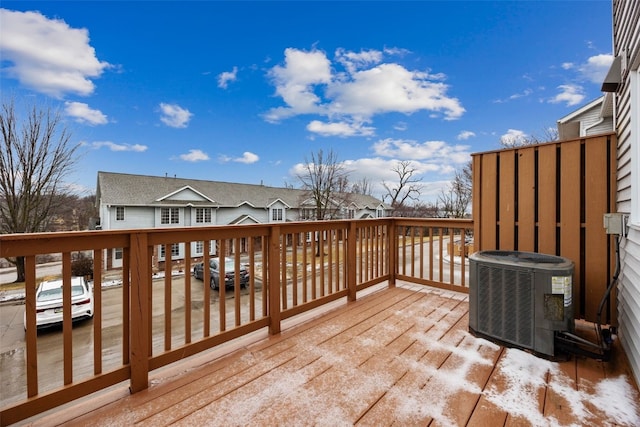 wooden deck featuring central AC unit