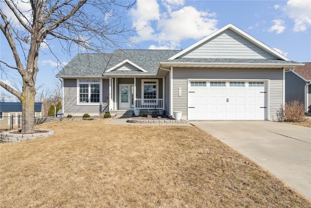 view of front of house featuring a front yard, driveway, roof with shingles, a porch, and a garage