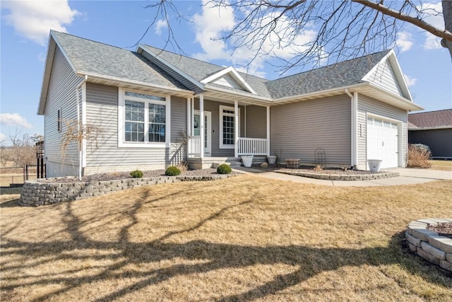 view of front facade with a front yard, fence, driveway, a porch, and a garage