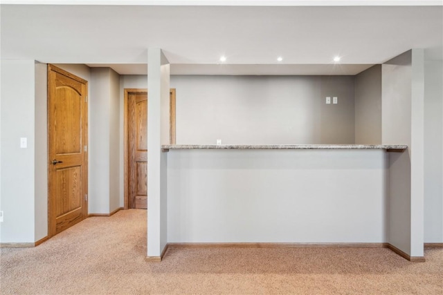 interior space featuring recessed lighting, carpet, and baseboards