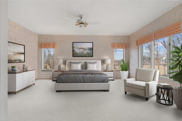 bedroom with wallpapered walls, carpet, baseboards, and a ceiling fan