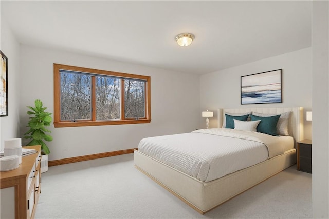 carpeted bedroom with baseboards