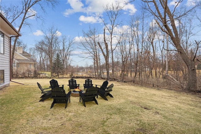 view of yard with an outdoor fire pit