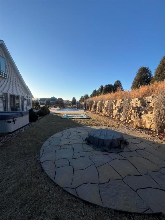 exterior space featuring a hot tub