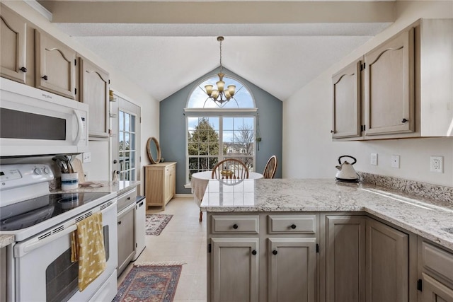 3260 Willowridge Rd Unit D, Marion, IA 52302 - kitchen with white appliances, a peninsula, a chandelier, vaulted ceiling, and pendant lighting