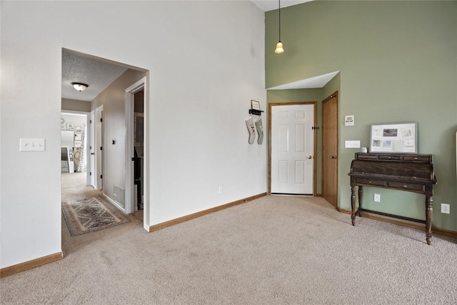 3260 Willowridge Rd Unit D, Marion, IA 52302 - carpeted foyer entrance featuring a high ceiling and baseboards