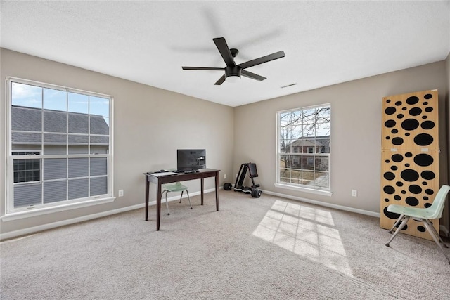3260 Willowridge Rd Unit D, Marion, IA 52302 - carpeted home office with a ceiling fan and baseboards
