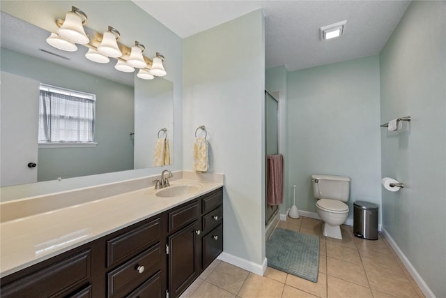 3260 Willowridge Rd Unit D, Marion, IA 52302 - bathroom featuring toilet, tile patterned flooring, a shower stall, and vanity