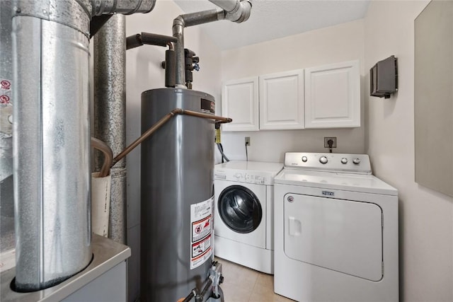 3260 Willowridge Rd Unit D, Marion, IA 52302 - laundry room featuring washer and dryer, water heater, cabinet space, and light tile patterned flooring