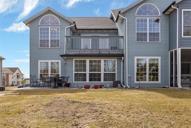 3260 Willowridge Rd Unit D, Marion, IA 52302 - back of house featuring a balcony, a lawn, and a patio
