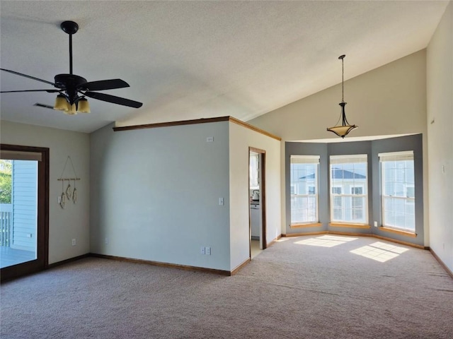 3260 Willowridge Rd Unit D, Marion, IA 52302 - carpeted empty room with vaulted ceiling, baseboards, and ceiling fan