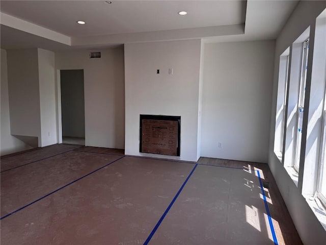 225 Meadows Field Dr NE, Cedar Rapids, IA 52402 - unfurnished living room with a tray ceiling and recessed lighting