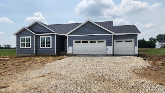 225 Meadows Field Dr NE, Cedar Rapids, IA 52402 - view of front of home with gravel driveway and an attached garage