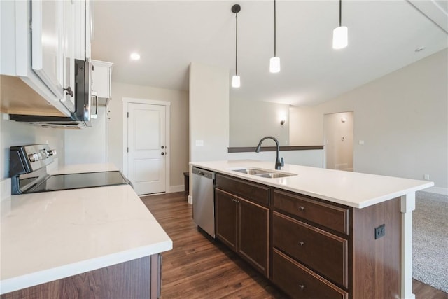 kitchen featuring a sink, dark brown cabinets, light countertops, appliances with stainless steel finishes, and dark wood-style flooring