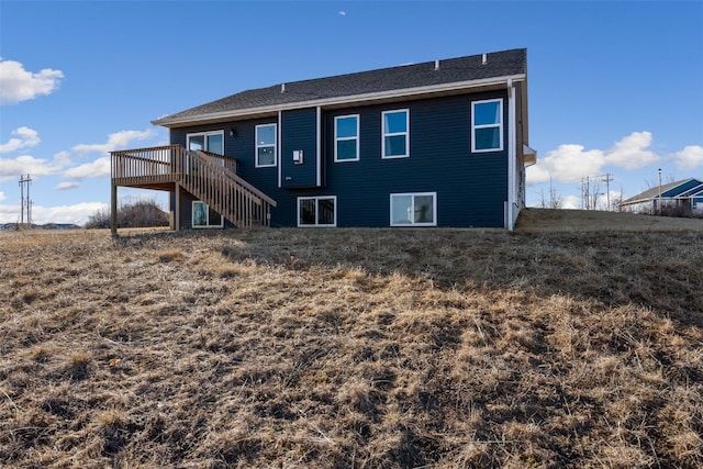 back of house with stairway and a wooden deck