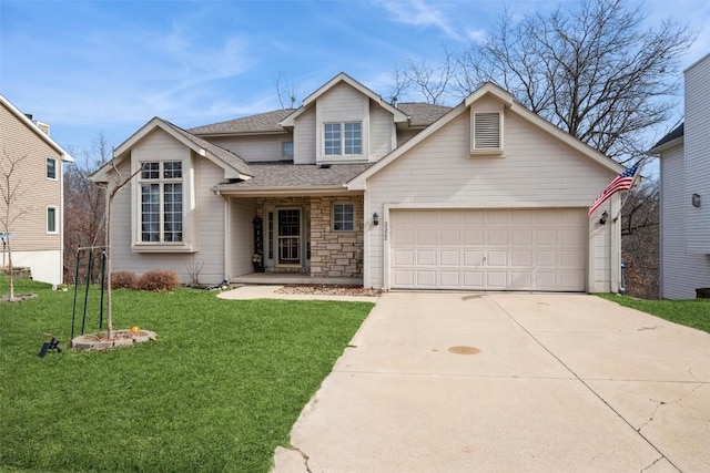 traditional-style house featuring roof with shingles, an attached garage, a front lawn, concrete driveway, and stone siding