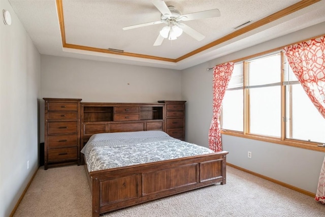 bedroom with visible vents, light carpet, and a raised ceiling