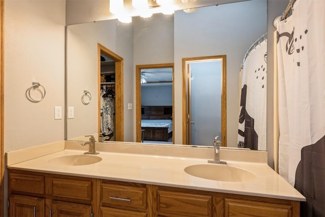 bathroom with a sink and double vanity