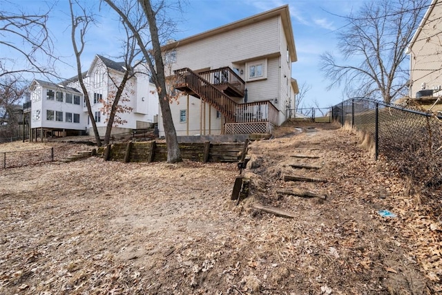 back of house with stairs and fence