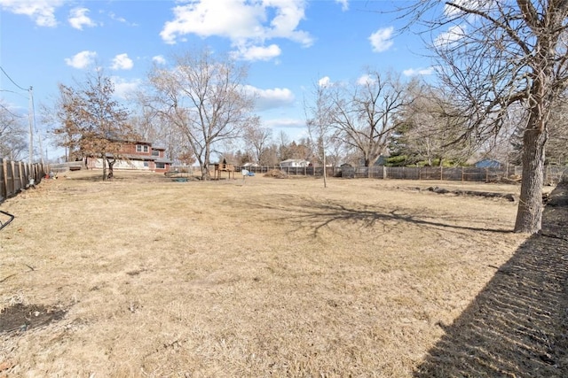 view of yard featuring a rural view and fence