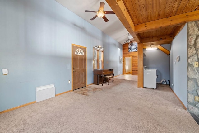 interior space with a ceiling fan, carpet floors, washer / dryer, baseboards, and wood ceiling