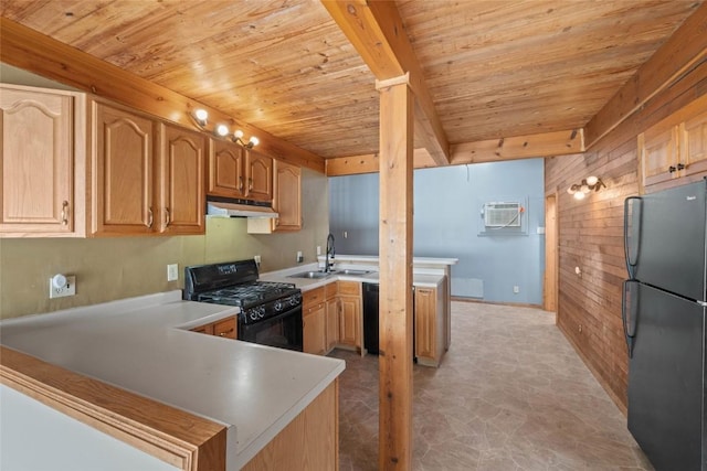 kitchen featuring black appliances, a wall mounted AC, under cabinet range hood, a sink, and a peninsula