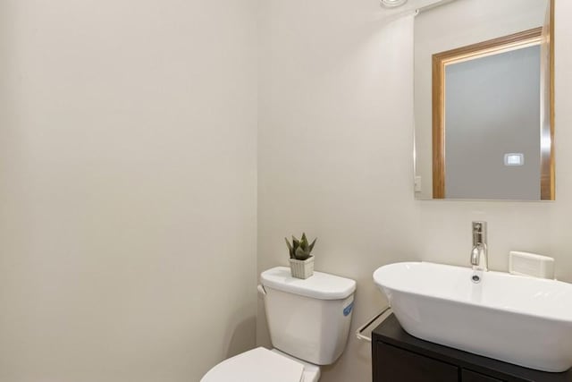 bathroom with toilet and vanity