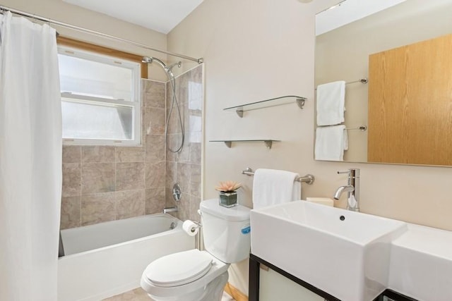 bathroom with vanity, toilet, and shower / tub combo