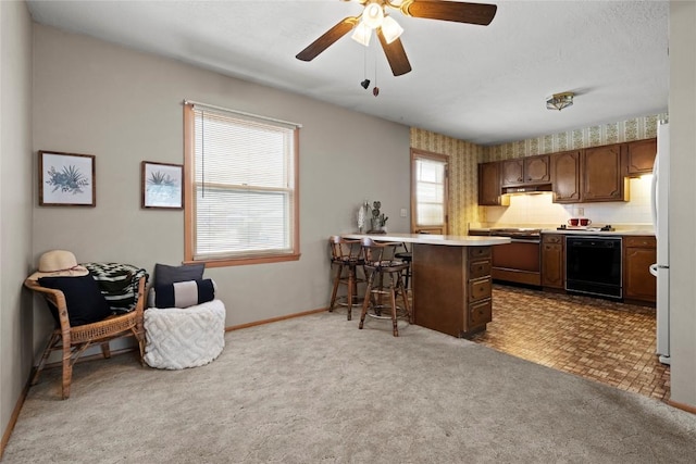 kitchen featuring a breakfast bar, black dishwasher, a peninsula, carpet flooring, and light countertops