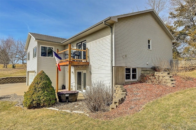 view of side of home with concrete driveway and a garage