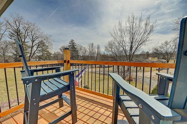 wooden terrace with a yard