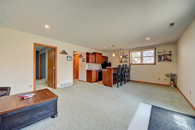 interior space with recessed lighting, baseboards, visible vents, and light carpet